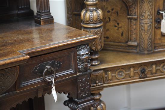 A late 19th century large carved oak breakfront sideboard, W.7ft 9in.